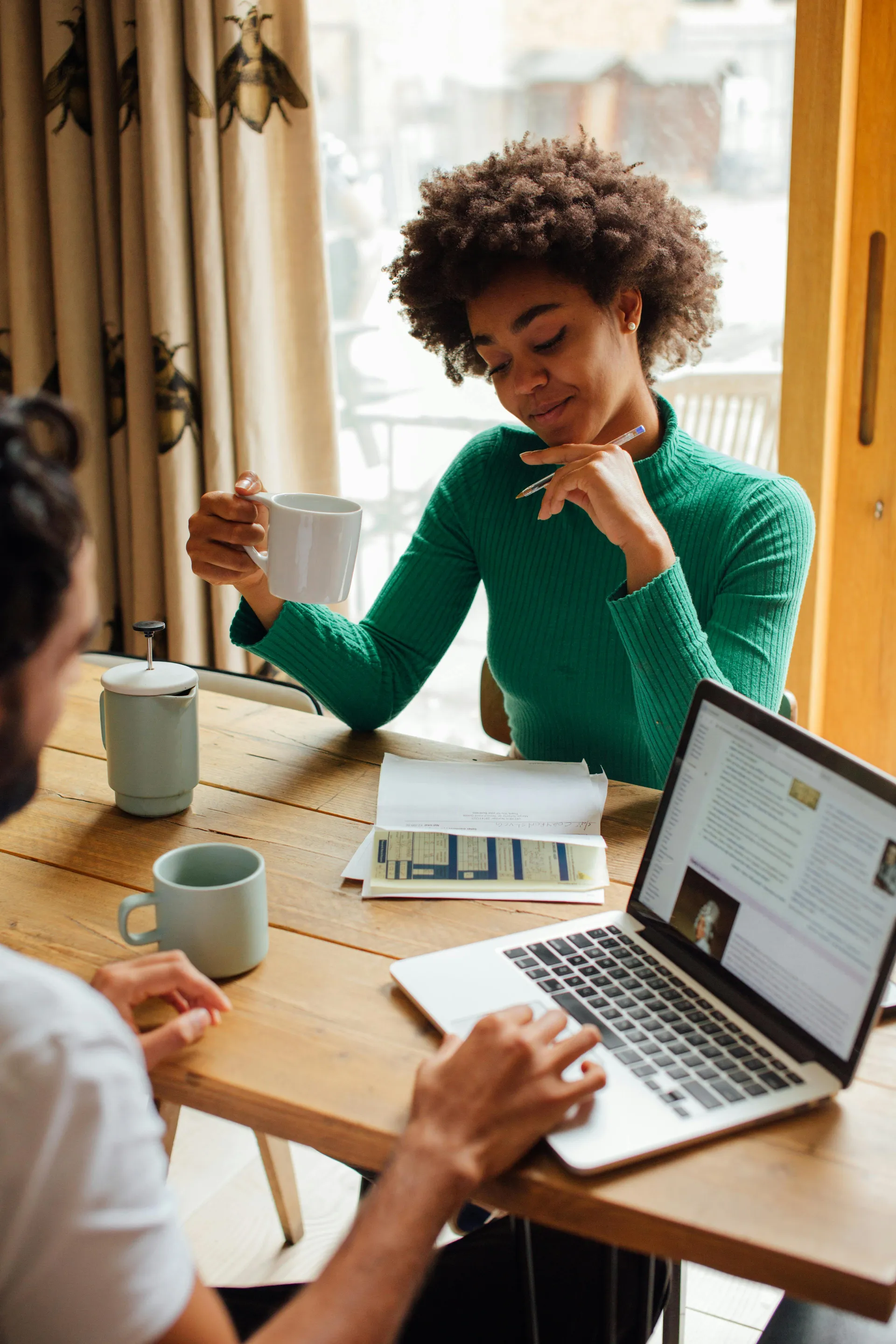 A consultation over coffee and a laptop